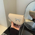 Beige litchi grain mini crossbody bag with silver bow accent and ball chain strap - Khaki