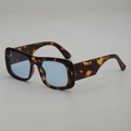 Square tortoise shell sunglasses with blue lenses and wide temples in a 3/4 side view - Tortoiseshell Frame Blue Lens
