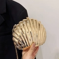 Elegant gold shell-shaped evening clutch bag with metallic radiance and fine chain strap - Gold