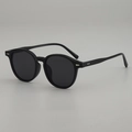 Retro oval sunglasses in black frame with dark lenses and silver rivet accents - Black Frame Grey Lens