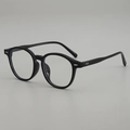 Classic retro oval sunglasses with glossy black frames and silver rivet accents - Black Frame Clear Lens