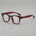 Vintage round eyewear in translucent burgundy with classic metal stud accents - Wine Red Frame Plain Glass