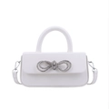 Elegant white leather handbag with a sparkling silver rhinestone bow decoration - White