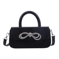 Elegant black leather handbag with a sparkling rhinestone bow and detachable strap - Black