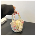 Handmade pearl beaded bucket bag with colorful acrylic accents and a satin bow charm - White
