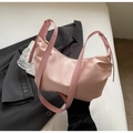 Pink satin hobo bag with floral texture and leather straps on grey blazer suit - Pink