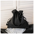 Borsa a secchiello minimalista in tela nera con coulisse e tracolla larga in pelle - Nero
