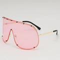Oversize-Schutzbrille mit rosa Gläsern und schwarzen Nieten am goldenen Metallrahmen - Goldener Rahmen Rosa Gläser