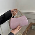 Detail of pink glitter evening bag with rhinestone handle and golden crown clasp - Pink