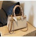 Detail of cream croc-embossed handbag featuring gold twist lock and silk scarf handle decor - Off White