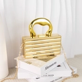 Golden striped acrylic box clutch with thick metal handle and elegant chain strap - Gold Stripes