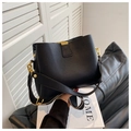 Chic black litchi grain bucket bag with gold hardware and contrast fabric strap - Black