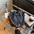 Blue denim bucket bag with brown leather braided handle and plush pompom accessory - Dark Blue