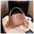 Pink lychee grain leather handbag with wide adjustable shoulder strap and gold hardware - Pink