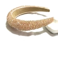 Macro shot of sparkling champagne pink crystal beads on a wide sponge headband detail - Champagne