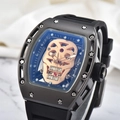 Detail of rose gold skull dial with ruby inlay and tonneau case on luxury men's watch - Black-Black
