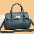 Dark teal crocodile embossed handbag with woven handles and silver twist lock detail - Blue