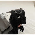 Quilted black mini backpack with silver metal chain and textured cloud finish - Black