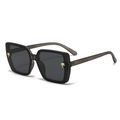 Square black frame sunglasses with golden palm tree accent and translucent gray temples - Matte Grey Frame Grey Lens