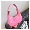 Sleek pink patent leather dumpling bag with glossy finish and silver metal buckles - Pink