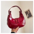 Glossy burgundy patent leather dumpling bag with minimalist handle and half-moon design - Red