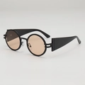 Retro round sunglasses with black leather texture frames and amber lenses in 45-degree view - Black Frame Tea Lens