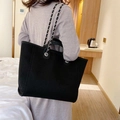 Women's black woven tote bag with silver chain strap and minimalist stylish design - Black