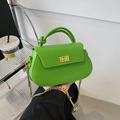 Bright green crossbody chain bag with unique knot handle and gold-tone turn-lock closure - Green