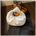 White knotted hilt pleated handbag with a half-moon cloud shape on black fabric - White