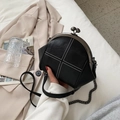 Elegant black shell bag with litchi grain leather and white cross stitching detail - Black and White