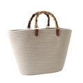 Cream woven tote bag featuring vintage-style bamboo handles and large capacity - Beige