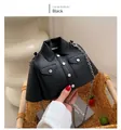 Detail view of a black motorcycle jacket shaped crossbody bag with metallic chain straps - Black