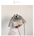 Detail of silver shirt-shaped handbag featuring metal rivets, collar, and chain strap - Silver