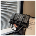 Quilted black leather crossbody bag with V-shaped texture and metal chain strap - Black