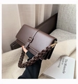 Dark brown leather crossbody bag with distinctive thick braided handle and gold clasp - Brown