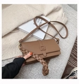 Brown leather crossbody bag with adjustable strap and thick woven handle on beige knit - Light Coffee