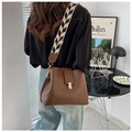 Detail of vintage brown leather bag with golden hardware and herringbone woven strap - Brown