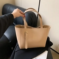 Elegant beige tote bag with decorative metal buckle strap and top handle design - Khaki