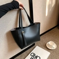 Minimalist black leather tote bag with gold hardware buckle and long shoulder straps - Black