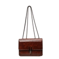 Vintage brown oil wax leather shoulder bag with a metal chain strap on a white background - Caramel color