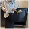 Handmade black woven straw tote bag featuring natural bamboo handles and metal rings - Black