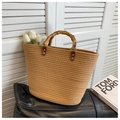 Brown woven straw tote bag featuring natural bamboo handles and textured spiral pattern - Khaki