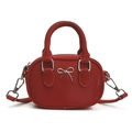 Mini red crossbody bag with glossy PU leather finish and silver metal bow detail - Red