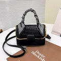 Minimalist black crossbody bag with crocodile texture, gold trim, and silk scarf handle - Black