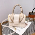 Beige faux crocodile leather crossbody bag with silk scarf handle on glass stand - Off White