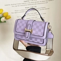 Close-up of purple quilted crossbody bag with golden H buckle and canvas strap - Violet