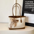 Minimalist beige woven tote bag with brown leather trim and a houndstooth scarf handle - Off White