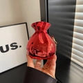 Metallic red purse shaped like a fortune bag with golden chain and sleek finish - Red