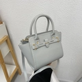 Elegant light blue litchi grain leather handbag with gold hardware and shoulder strap - Light Gray