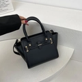 Minimalist black leather handbag with gold hardware and removable shoulder strap - Black